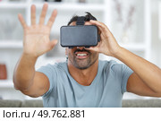 man is using a vr mask. Стоковое фото, агентство Ingram Publishing / Фотобанк Лори