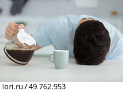 sleepy man with a cup of coffee. Стоковое фото, агентство Ingram Publishing / Фотобанк Лори
