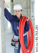 professional plumber in uniform talking to client indoors. Стоковое фото, агентство Ingram Publishing / Фотобанк Лори