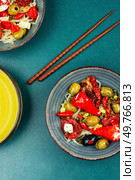 Pickled soya bean salad with pickled soybean sprouts, dried tomatoes, olives and peppers. Korean Food. Flat lay. Salad of preserved soy sprouts and pickled vegetables. Стоковое фото, агентство Ingram Publishing / Фотобанк Лори