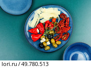 Mediterranean snack assortment. Assortment of antipasti on a plate. Flat lay. A set of food. Стоковое фото, агентство Ingram Publishing / Фотобанк Лори