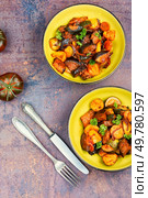 Healthy vegetarian lunch - stewed vegetables, vegetable ratatouille. Flat lay. Autumnal vegetable stew. Стоковое фото, агентство Ingram Publishing / Фотобанк Лори
