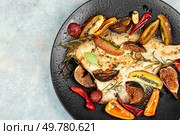 Traditional homemade braised cambala or flounder. Healthy fish dinner. Space for text.. Grilled fish with fruits. Стоковое фото, агентство Ingram Publishing / Фотобанк Лори