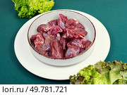 Sliced raw venison deer meat for a stew.. Plate of raw goulash. Стоковое фото, агентство Ingram Publishing / Фотобанк Лори