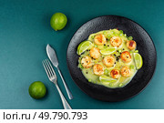 Scallops plated elegantly with a basil creamy sauce. Sea scallop fresh seafood fried. Top view.. Seafood, roasted scallops. Стоковое фото, агентство Ingram Publishing / Фотобанк Лори