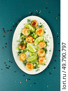 Sea scallop appetizer, fried scallops or grilled shellfish, healthy gourmet seafood. Top view.. Seasoning fried sea scallops. Стоковое фото, агентство Ingram Publishing / Фотобанк Лори
