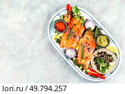 Fresh salmon pieces, fish fillet of salmon slices and ingredients. Dieting, cookbook recipe. Space for text.. Two uncooked, raw salmon fillets. Стоковое фото, агентство Ingram Publishing / Фотобанк Лори