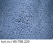 Abstract monochrome metallic blue gray texture. Many dents of various shapes and sizes on a shiny background. Copy space. Стоковое фото, фотограф Бузмакова Светлана / Фотобанк Лори