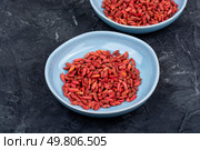 Natural goji berry snack. Goji berries in plate. Vegetarian and vegan food.. Wolfberry or Goji berry. Стоковое фото, агентство Ingram Publishing / Фотобанк Лори