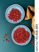 Dried Goji Berries in Bowl, Healthy Food, Superfood. Top view.. Goji berry, strengthening the immune system. Стоковое фото, агентство Ingram Publishing / Фотобанк Лори