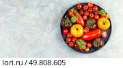 Ripe red cherry tomatoes. Vegetarian, vegan and raw food and diet. Organic homemade farm products.. A variety of fresh tomatoes. Стоковое фото, агентство Ingram Publishing / Фотобанк Лори