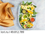 Delicious egg omelette with broccoli and pepper. Vegetarian omelet scrambled eggs with broccoli and vegetables. Homemade omelette with vegetables. Стоковое фото, агентство Ingram Publishing / Фотобанк Лори