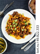 Tatar cuisine, Azu dish, traditional Tatar meat stew made from beef with potatoes , tomato sauce and pickles.. Azu in Tatar from beef, meat ragout. Стоковое фото, агентство Ingram Publishing / Фотобанк Лори