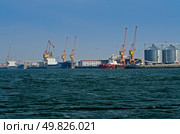 Large cargo ship docked in port. Стоковое фото, агентство Ingram Publishing / Фотобанк Лори