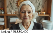 Smiling Elderly Woman Enjoying Relaxation at a Spa in the Comfort of Her Cozy Room. Стоковое AI-видео, аниматор Оксана Медведева / Фотобанк Лори