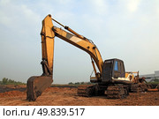 Excavator Loader with backhoe standing in sandpit. Стоковое фото, агентство Ingram Publishing / Фотобанк Лори