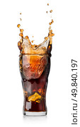 Cola drink with splash isolated on white background. Стоковое фото, агентство Ingram Publishing / Фотобанк Лори