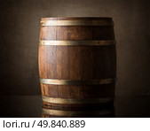 Old wooden barrel on a brown background. Стоковое фото, агентство Ingram Publishing / Фотобанк Лори