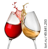 Splashes of wine in two wineglasses isolated on white. Стоковое фото, агентство Ingram Publishing / Фотобанк Лори