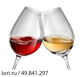 Moving wine in two wineglasses isolated on white. Стоковое фото, агентство Ingram Publishing / Фотобанк Лори