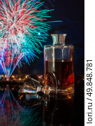 bottle of whiskey on a background of fireworks. Стоковое фото, агентство Ingram Publishing / Фотобанк Лори