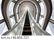 perspective escalators stairway inside contemporary blue glass business centre, concept of successful career elevation. Стоковое фото, агентство Ingram Publishing / Фотобанк Лори