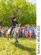 Russia, Samara, June 2016: A dashing Cossack on horseback during a demonstration performance at the Journey to the Past festival. Редакционное фото, фотограф Акиньшин Владимир / Фотобанк Лори