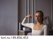 Moments of Introspection in the Quiet Solitude of a Lonely Woman Seeking Peace Within. Стоковое фото, фотограф Aleksandr Golubev / Фотобанк Лори