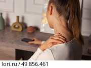 Loneliness Envelops a Woman in a Quiet Room as She Grapples With Her Emotions in Stillness. Стоковое фото, фотограф Aleksandr Golubev / Фотобанк Лори