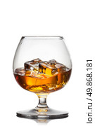 Splash of whiskey with ice in glass isolated on white background. Стоковое фото, агентство Ingram Publishing / Фотобанк Лори