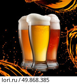 Different beer in glasses with splash isolated on black background. Стоковое фото, агентство Ingram Publishing / Фотобанк Лори