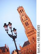 Belfry bell tower on sunset in Bruges, Belgium. Стоковое фото, агентство Ingram Publishing / Фотобанк Лори