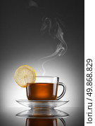 cup of hot tea with lemon and steam. Стоковое фото, агентство Ingram Publishing / Фотобанк Лори