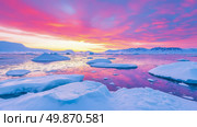 Arctic landscape with ice floes and a sky colored by the sunset, illustrating a stark and beautiful environment. Стоковое AI-изображение, AI-художник Данила Большаков / Фотобанк Лори