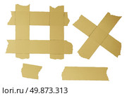 Masking tape torn strips of isolated elements of strong adhesive beige paper material asa office supplies used in packaging boxes or repairing or fixing broken things that need to be sealed air tight. Стоковое фото, агентство Ingram Publishing / Фотобанк Лори
