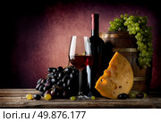 Wine with maasdam and grape near wooden cask. Стоковое фото, агентство Ingram Publishing / Фотобанк Лори