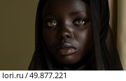 African American woman with a black veil covering her head, standing with a solemn expression. Стоковое AI-изображение, AI-художник Данила Большаков / Фотобанк Лори