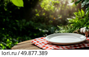 Empty White Plate on Checkered Cloth Surrounded by Greenery in a Serene Outdoor Setting. Стоковое AI-изображение, AI-художник Юлия Гапеенко / Фотобанк Лори