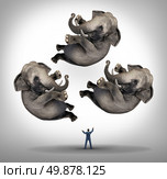 Leadership management businees concept with a businessman juggler juggling three elephants up in the air as a symbol of managing power and being a strong leader and a metaphor for expertise and skill. Стоковое фото, агентство Ingram Publishing / Фотобанк Лори