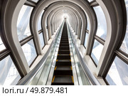 perspective escalators stairway inside contemporary blue glass business centre, concept of successful career elevation. Стоковое фото, агентство Ingram Publishing / Фотобанк Лори