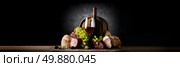 Composition with wine and food on a black background. Стоковое фото, агентство Ingram Publishing / Фотобанк Лори