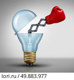 Creative weapon symbol and game changer business concept for the power of ideas and fighting to pitch powerful innovation as  a red boxing glove emerging out of an open light bulb as an icon of creativity success with out of the box thinking. Стоковое фото, агентство Ingram Publishing / Фотобанк Лори