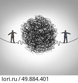Partnership problem and business confrontation concept as two business people walking on a high wire tightrope with a tangled group of wire obstacle dividing the businessmen as a crisis metaphor for professional relationship stress. Стоковое фото, агентство Ingram Publishing / Фотобанк Лори