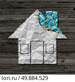 Home repair concept and house improvement symbol as crumpled paper shaped as a residential structure with torn pieces as an icon for renovations and maintenance. Стоковое фото, агентство Ingram Publishing / Фотобанк Лори