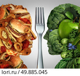 Nutrition decision concept and diet choices dilemma between healthy good fresh fruit and vegetables or greasy cholesterol rich fast food shaped as a human head divided by a fork as a symbol for trying to decide what to eat. Стоковое фото, агентство Ingram Publishing / Фотобанк Лори