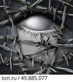 Anonymous victim concept and nameless intruder threat being kept out by barbed or barb wire as a security or psychological injury concept of suffering alone with a surreal human blank eye. Стоковое фото, агентство Ingram Publishing / Фотобанк Лори
