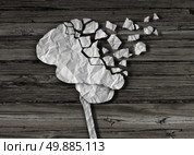 Dementia or brain damage and injury as a mental health and neurology medical symbol with a thinking human organ made of crumpled paper torn in pieces as a creative concept for alzheimer disease. Стоковое фото, агентство Ingram Publishing / Фотобанк Лори