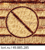 No cake symbol as an eating sweets concept of self control and craving restraint for a healthy food lifestyle by avoiding sugar snacks and high fat baked goods as a pastry with the prohibited icon imbedded in the dough. Стоковое фото, агентство Ingram Publishing / Фотобанк Лори