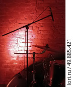 Drum kit, cymbals and microphone on red brick background. Стоковое фото, фотограф Евгений Ткачёв / Фотобанк Лори