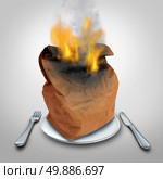 Burning calories or burn calorie concept and hot lunch idea or food waste symbol as a brown paper lunch bag that is in flames on a plate as an icon for spicy cuisine or contaminated meal problem. Стоковое фото, агентство Ingram Publishing / Фотобанк Лори